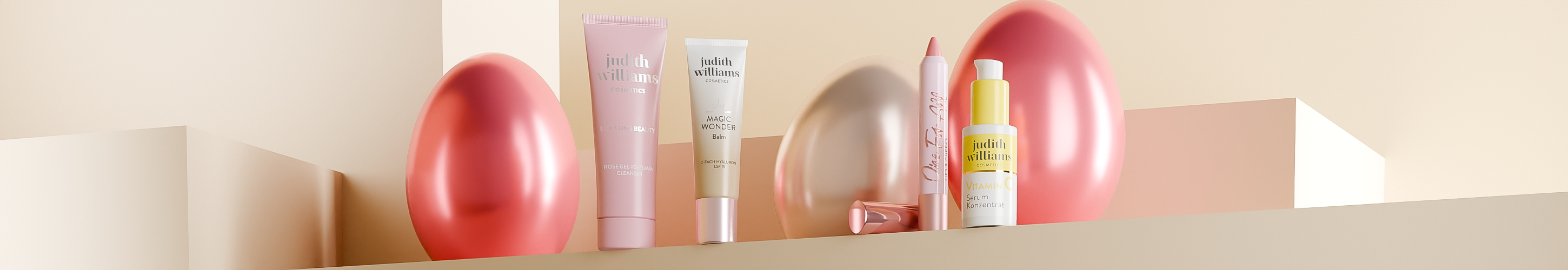 Produkte von Judith Williams Cosmetics mit Ostereiern im Hintergrund.