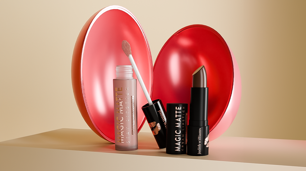 Zwei Lippenprodukte von Judith Williams Cosmetics, mit einem Osterei im Hintergrund.