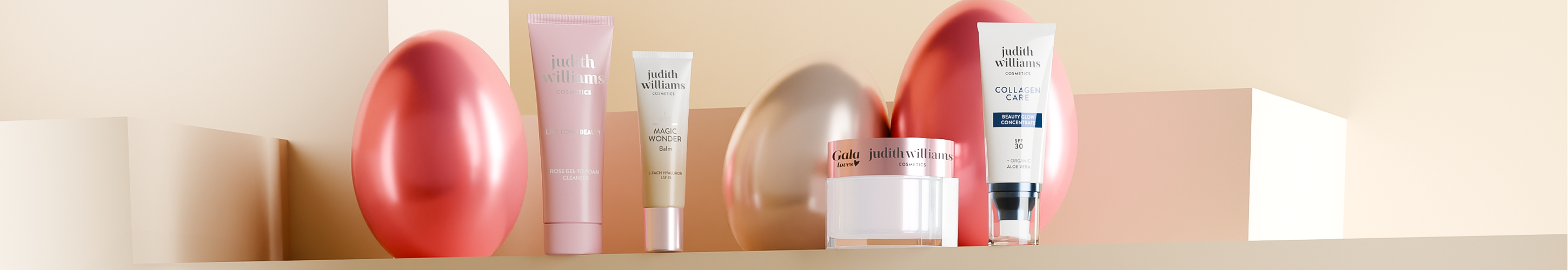 Vier Produkte von Judith Williams Cosmetics mit Ostereier im Hintergrund. 